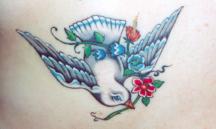 Flying dove tattoo